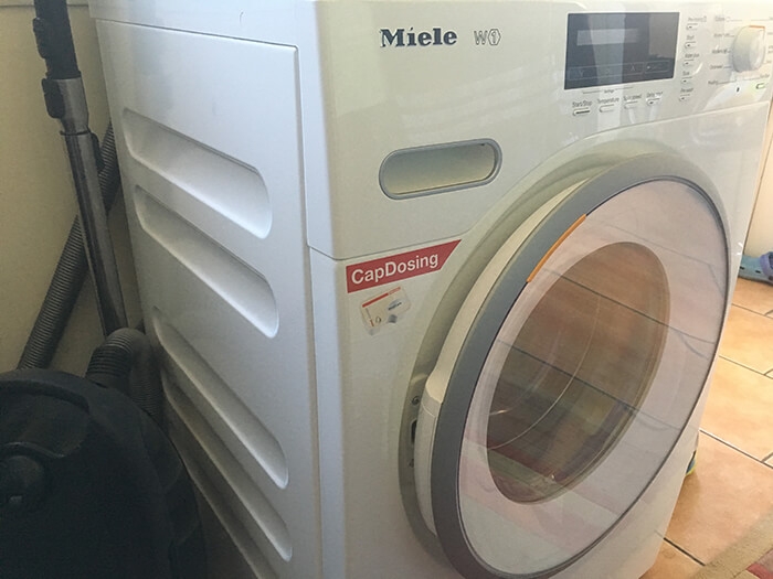 Washing machine in a house kitchen